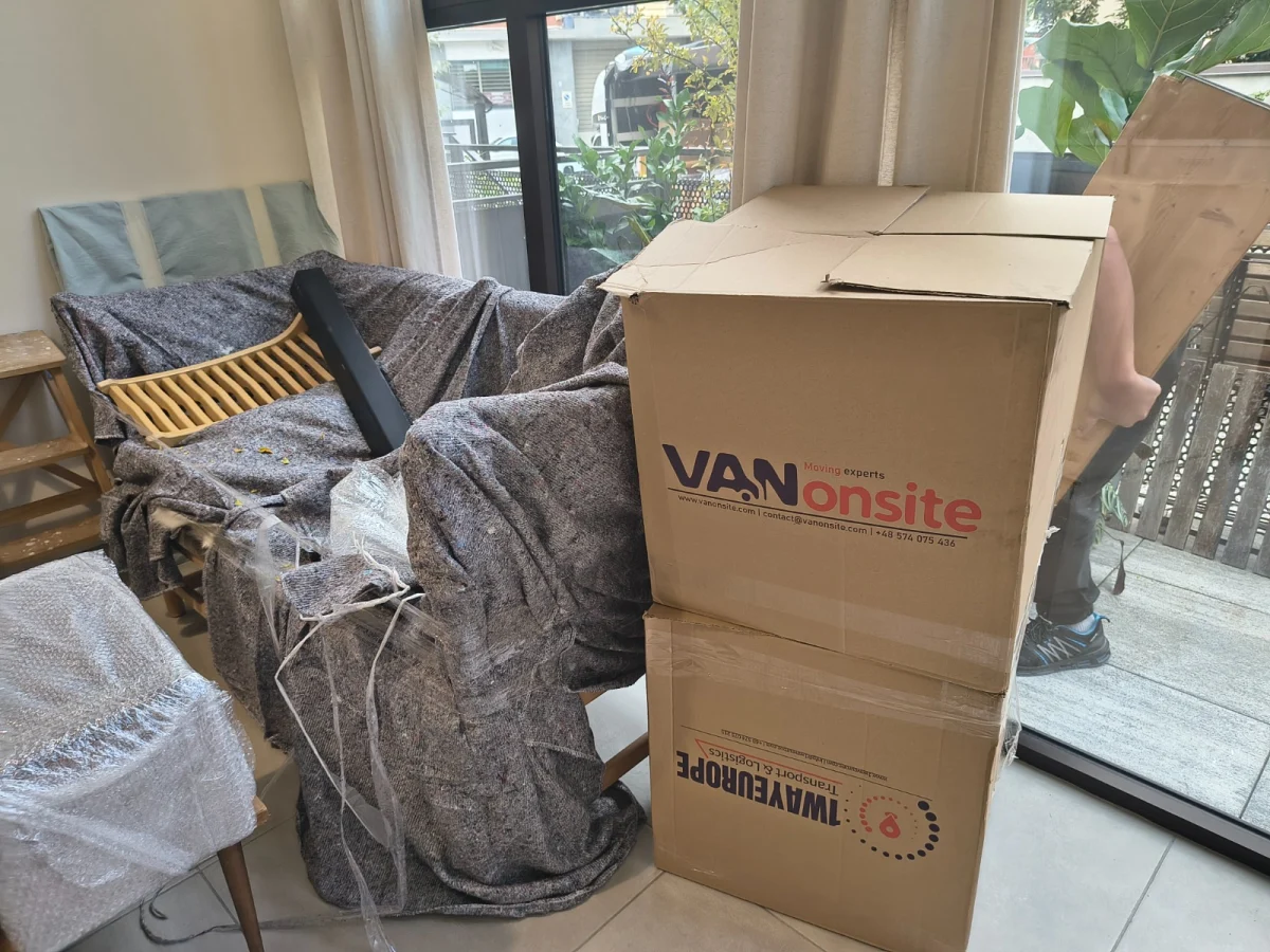 Protected furniture and moving boxes inside a home